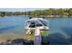 Picturesque boat dock on the lake with a jet ski lift, perfect for water activities and relaxing at 6160 Lake Lanier Heights Rd, Buford, GA 30518