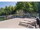 Outdoor deck with lounge chairs, overlooking a landscaped backyard and lake, perfect for relaxation at 6160 Lake Lanier Heights Rd, Buford, GA 30518