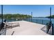 Lakeside deck with lounge chairs and panoramic water views, creating a serene outdoor space at 6160 Lake Lanier Heights Rd, Buford, GA 30518