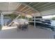Covered dock with boat slip, and dining area, providing a perfect lakeside retreat at 6160 Lake Lanier Heights Rd, Buford, GA 30518
