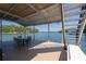 Lake view from a dock with boat slip, covered seating area, and dining table at 6160 Lake Lanier Heights Rd, Buford, GA 30518