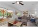 Comfortable living room featuring a large sectional sofa, modern decor, and sliding glass doors to covered patio at 6160 Lake Lanier Heights Rd, Buford, GA 30518