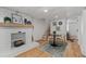 Cozy seating area features a decorative fireplace, nautical decor, and access to a bedroom at 6160 Lake Lanier Heights Rd, Buford, GA 30518