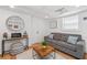 Inviting living room features a cozy sofa, stylish coffee table, and lake-themed accents at 6160 Lake Lanier Heights Rd, Buford, GA 30518