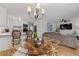Open concept living space and kitchen area with hardwood floors, and ceiling fan at 6160 Lake Lanier Heights Rd, Buford, GA 30518