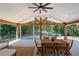Covered patio featuring wood beams, lighting, and open views of the lake at 6160 Lake Lanier Heights Rd, Buford, GA 30518