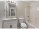Neutral bathroom featuring a shower-tub combo and single vanity with storage at 700 Thomasville Se Blvd, Atlanta, GA 30315