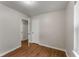 A clean bedroom has light gray walls, a window and wood-look floors at 700 Thomasville Se Blvd, Atlanta, GA 30315