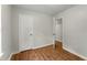Comfortable bedroom with wood-look floors and a view of the doorway to the next room at 700 Thomasville Se Blvd, Atlanta, GA 30315