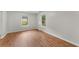 This bedroom offers natural light, wood-look flooring, and freshly painted walls at 700 Thomasville Se Blvd, Atlanta, GA 30315