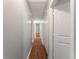 Hallway featuring hardwood floors and white doors leading to rooms at 700 Thomasville Se Blvd, Atlanta, GA 30315