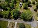 Inviting home nestled among mature trees in a quiet neighborhood, featuring a paved driveway at 1643 Cumberland Trce, Acworth, GA 30102