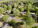 Aerial shot of houses in a residential neighborhood with mature trees and green lawns at 1643 Cumberland Trce, Acworth, GA 30102
