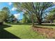 The expansive backyard features mature trees and lawn at 1643 Cumberland Trce, Acworth, GA 30102