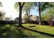 Spacious backyard featuring a tree swing, perfect for enjoying outdoor activities at 1643 Cumberland Trce, Acworth, GA 30102