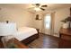 Comfortable bedroom featuring a full-sized bed, wood floors, and classic furnishings at 1643 Cumberland Trce, Acworth, GA 30102