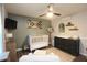 Modern Bedroom featuring a crib, changing table, mounted television and contemporary decor at 1643 Cumberland Trce, Acworth, GA 30102