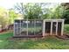 Backyard chicken coop, offering a perfect opportunity for farm-to-table living at 1643 Cumberland Trce, Acworth, GA 30102