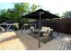 Inviting outdoor living space featuring a shaded pergola and comfortable seating on a spacious wooden deck at 1643 Cumberland Trce, Acworth, GA 30102