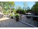 A beautiful wooden deck with black metal railings provides a luxurious outdoor living space at 1643 Cumberland Trce, Acworth, GA 30102