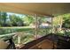 Relaxing front porch with a swing and ample space for outdoor seating overlooking the yard at 1643 Cumberland Trce, Acworth, GA 30102