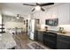 Bright kitchen with stainless steel appliances, granite counters, and an adjacent dining area at 1643 Cumberland Trce, Acworth, GA 30102