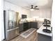 Charming kitchen featuring stainless steel appliances, granite countertops, and updated cabinetry at 1643 Cumberland Trce, Acworth, GA 30102
