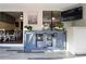 An additional living space featuring an elegant cabinet with a glass pane design and a television at 1643 Cumberland Trce, Acworth, GA 30102
