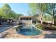 Backyard pool with stone patio and wooden deck, perfect for outdoor entertaining and relaxation at 1643 Cumberland Trce, Acworth, GA 30102