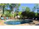Enjoy this inground pool and adjoining hot tub in a wooded backyard setting at 1643 Cumberland Trce, Acworth, GA 30102