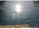 Sparkling pool water reflecting sunlight, creating a serene outdoor oasis at 1643 Cumberland Trce, Acworth, GA 30102
