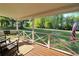 Inviting front porch with swing and rocking chairs, perfect for enjoying the outdoors at 1643 Cumberland Trce, Acworth, GA 30102
