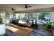 Bright sunroom with large windows offering views of the pool and surrounding landscape at 1643 Cumberland Trce, Acworth, GA 30102