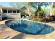 Outdoor swimming pool and lounge area, surrounded by lush landscaping and trees at 1643 Cumberland Trce, Acworth, GA 30102