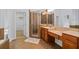 Bathroom with walk-in shower, double vanity, and ceramic tile flooring at 2050 Heritage Green Dr, Marietta, GA 30064
