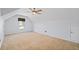 Large bonus room featuring neutral carpet, light walls, ceiling fan, and window at 2050 Heritage Green Dr, Marietta, GA 30064