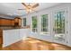 Eat-in kitchen area with natural light, hardwood floors, and views of lush greenery at 2050 Heritage Green Dr, Marietta, GA 30064