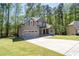 Charming two-story home with neutral siding, stone accents and an attached garage at 2050 Heritage Green Dr, Marietta, GA 30064
