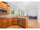 Open-concept kitchen with granite counters, stainless steel appliances, and hardwood floors at 2050 Heritage Green Dr, Marietta, GA 30064