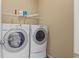 Bright laundry room featuring a side-by-side washer and dryer at 2050 Heritage Green Dr, Marietta, GA 30064