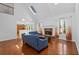 Bright living room with hardwood floors, a fireplace, a vaulted ceiling, and large windows offering scenic views at 2050 Heritage Green Dr, Marietta, GA 30064