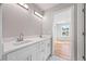 Bathroom with double sink vanity, white cabinetry, quartz countertop, and view into bedroom, showing seamless design at 3205 Tackett Rd, Douglasville, GA 30135
