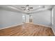 Bedroom with hardwood floors, ceiling fan, and ensuite bathroom at 3205 Tackett Rd, Douglasville, GA 30135
