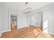 Open-concept dining area with hardwood floors, modern light fixture, and seamless access to the kitchen at 3205 Tackett Rd, Douglasville, GA 30135