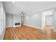 Bright living room boasts hardwood floors and a cozy fireplace at 3205 Tackett Rd, Douglasville, GA 30135