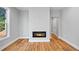 Cozy living room with hardwood floors and a modern fireplace at 3205 Tackett Rd, Douglasville, GA 30135