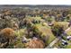 Wide shot aerial view of the homes settled in rolling hills and mature trees at 434 Mac Johnson Nw Rd, Cartersville, GA 30121