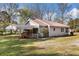 Exterior view of the backyard with a carport and access ramp at 434 Mac Johnson Nw Rd, Cartersville, GA 30121