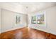 Bedroom showcasing two large windows, neutral walls, and hardwood floors at 434 Mac Johnson Nw Rd, Cartersville, GA 30121