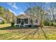 Charming single story home featuring a screened in front porch and a well manicured lawn at 434 Mac Johnson Nw Rd, Cartersville, GA 30121